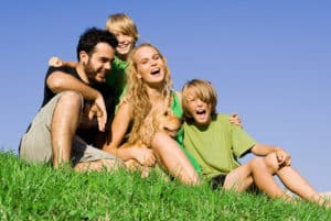 Family sitting on grass