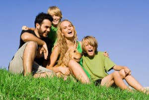 Family sitting on grass