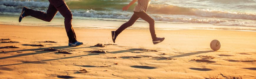 father and son with ball on beach: can keratoconus be hereditary?