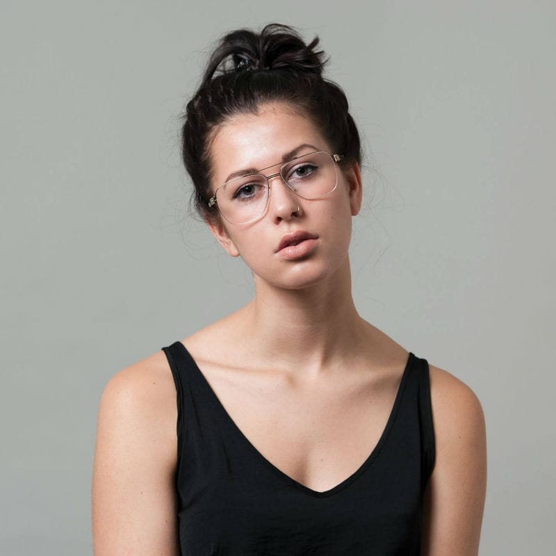 Lady wearing large pair of glasses.