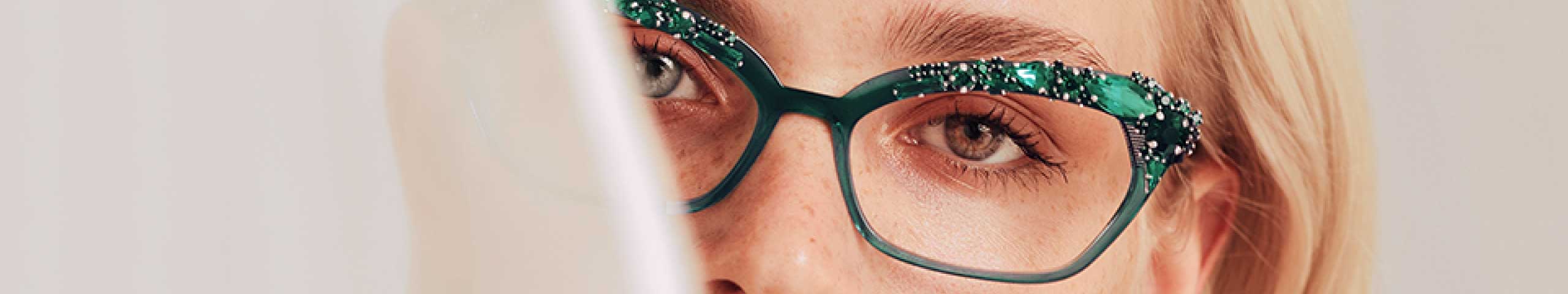 Woman wearing green Caroline Abram Glasses