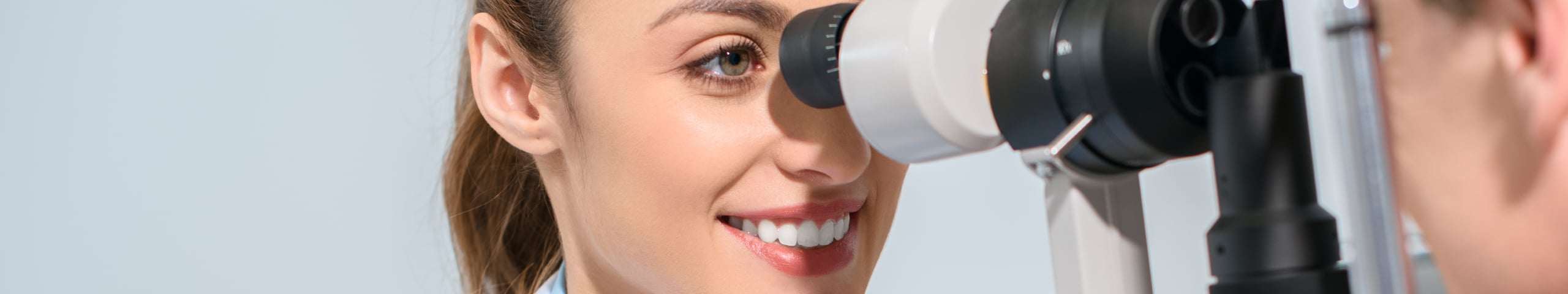 An optometrist checking patients eyes.