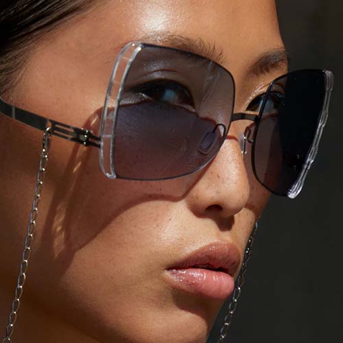 woman wearing ic! berlin sunglasses with chain.