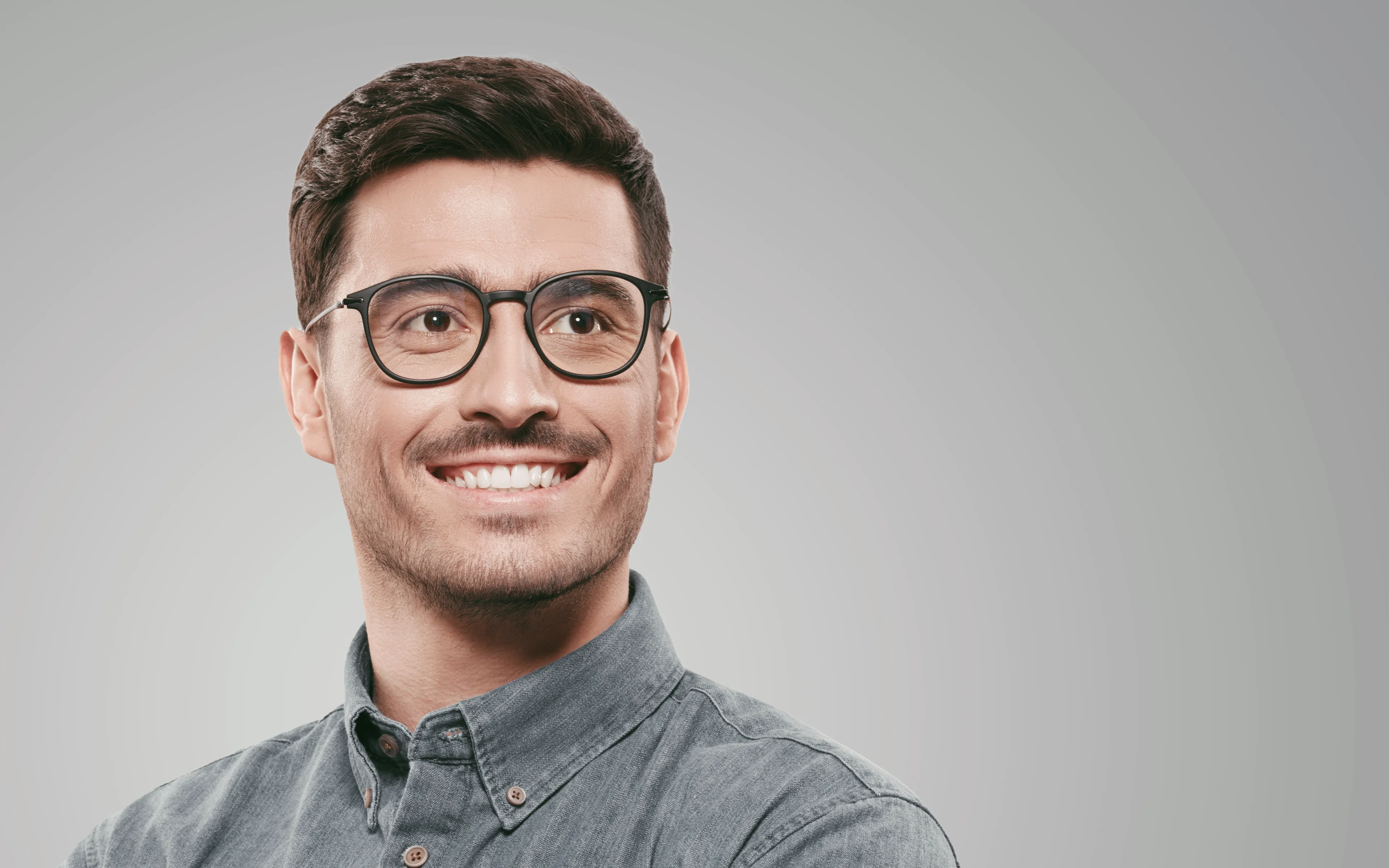 A young male wearing glasses.