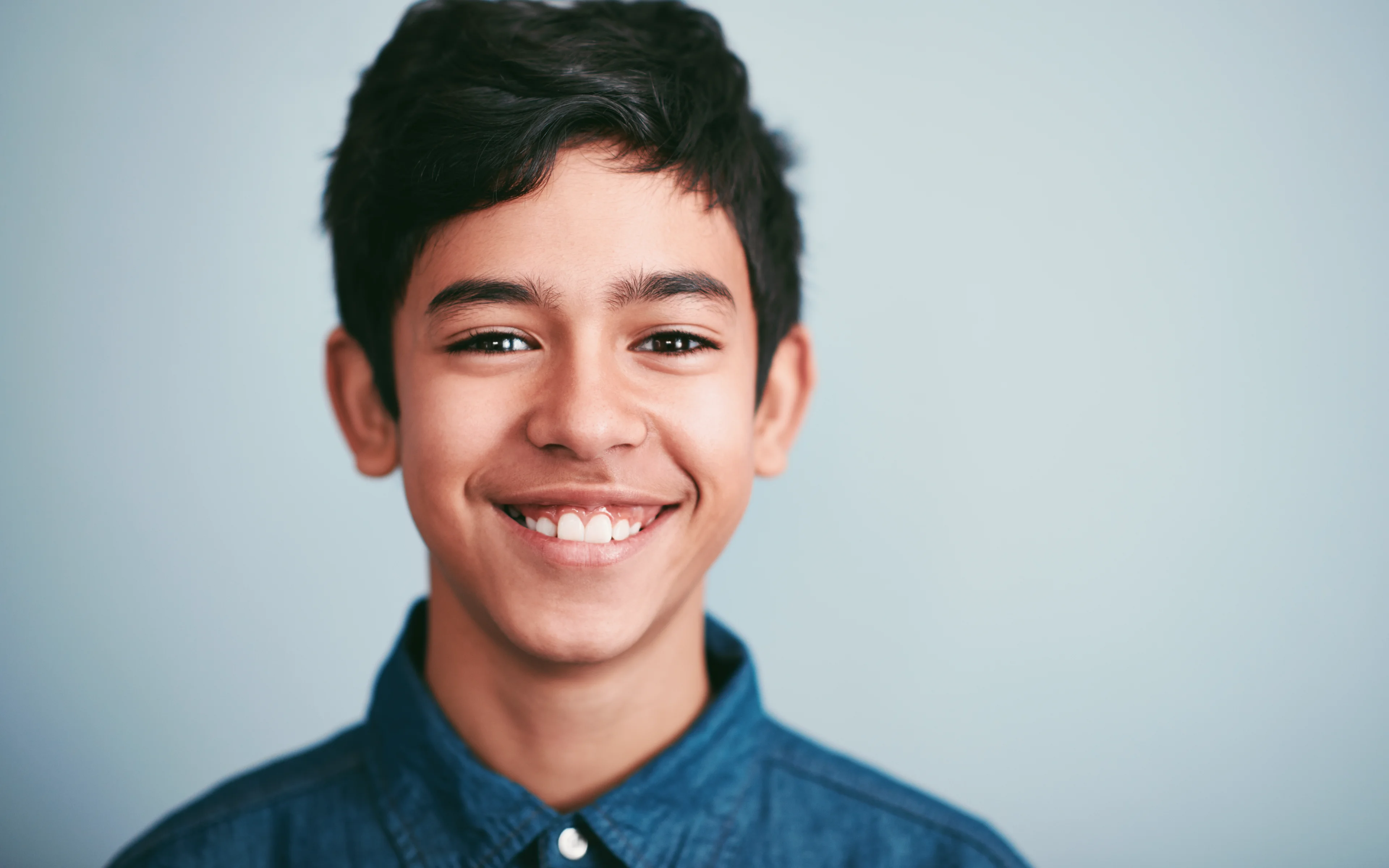 A smiling teenager.