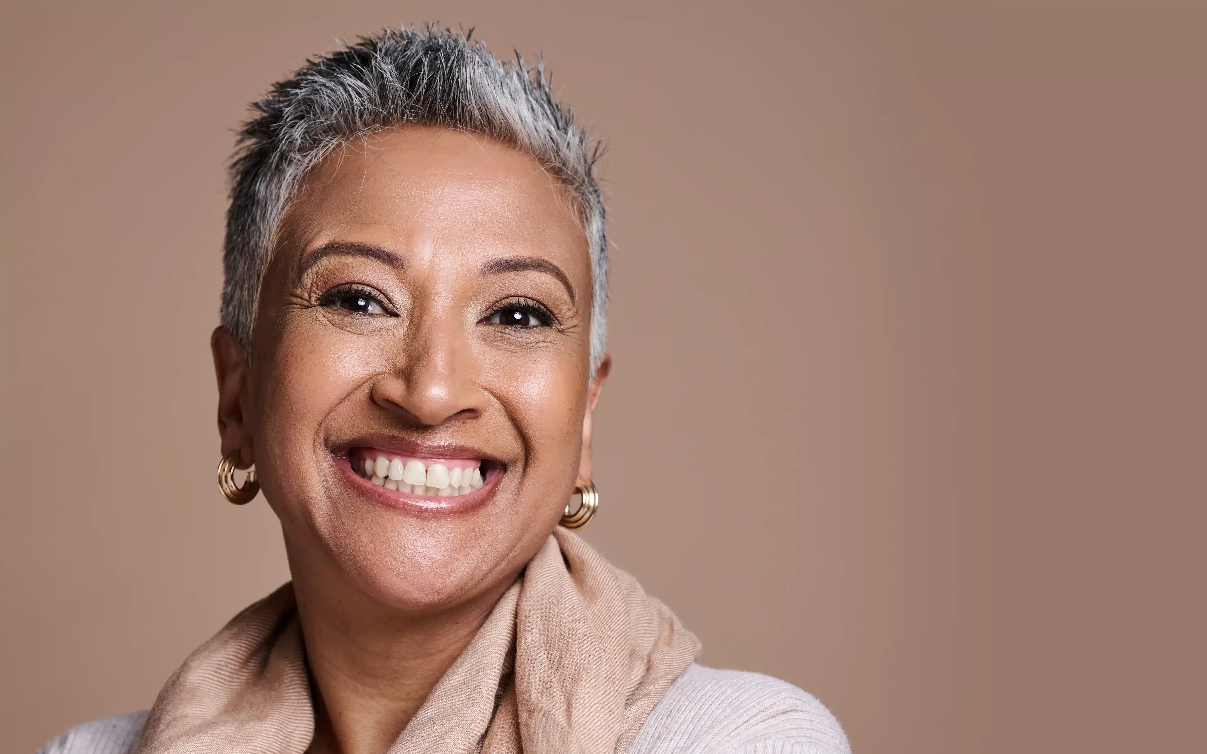 Similing middle-aged woman wearing contact lenses for dry eyes.