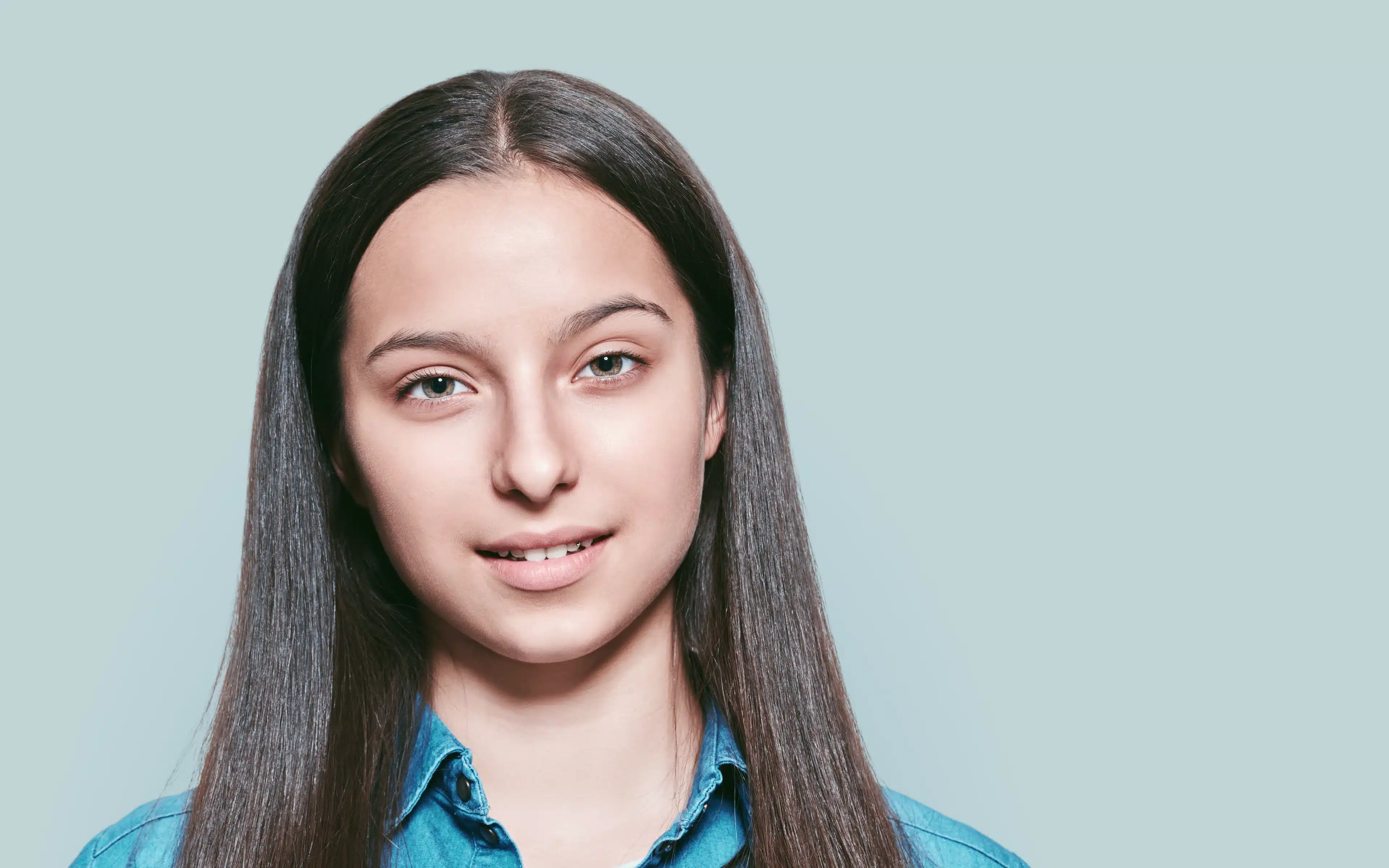 Portrait of teenage girl wearing hybrid contact lesnes.