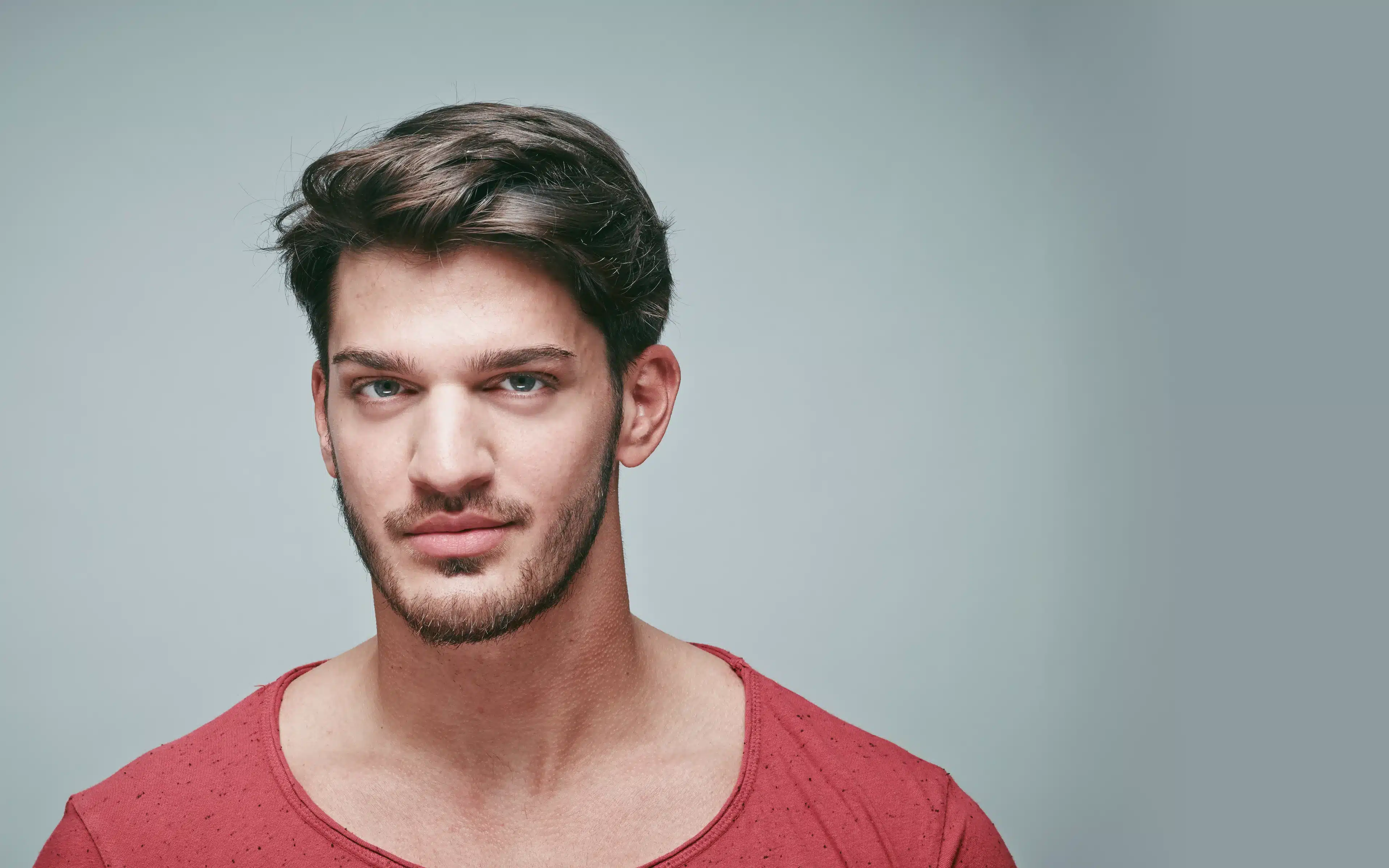 Portrait of bearded young blond man wearing contact lenses.