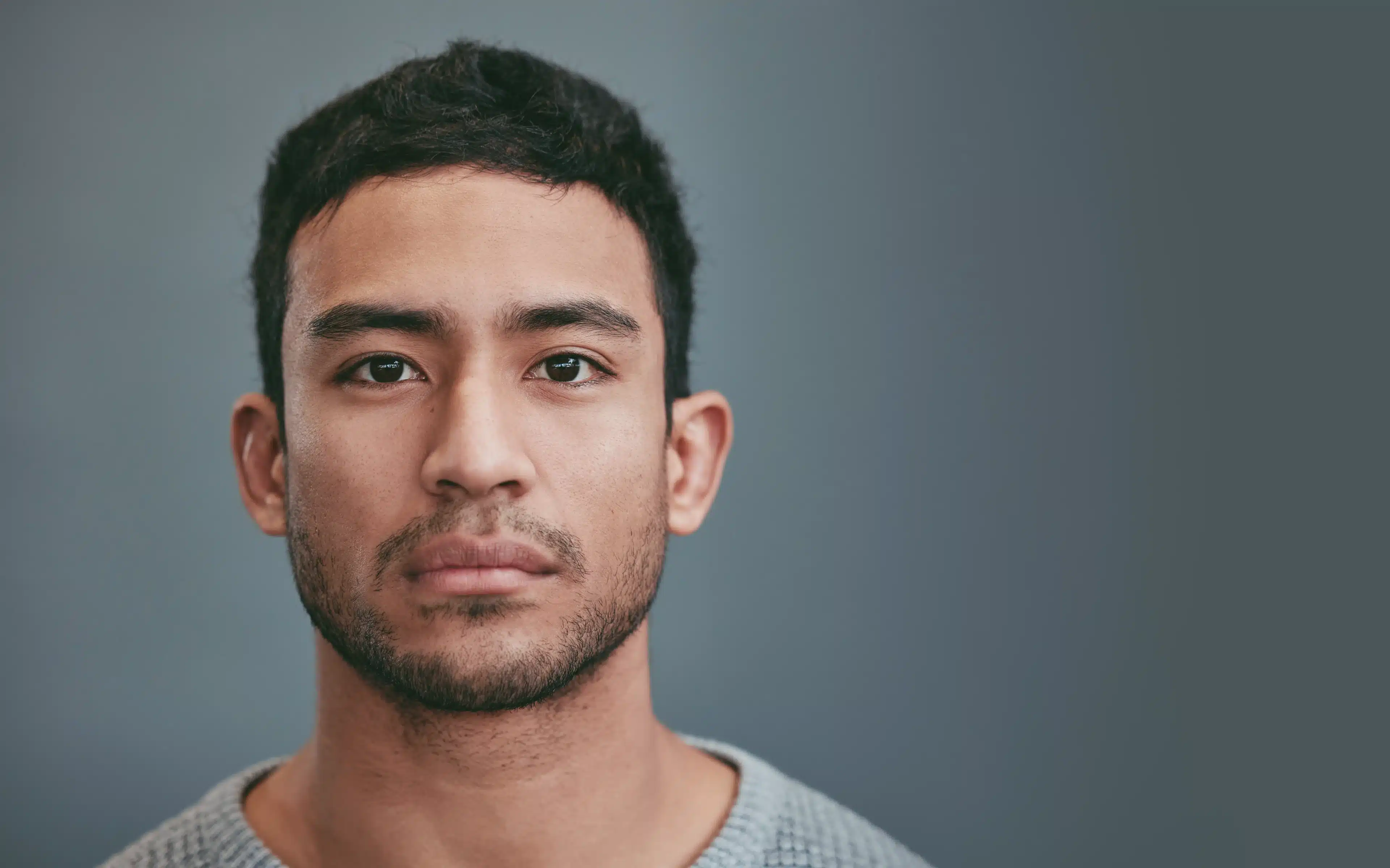 Shot of a handsome young man wearing toric contact lenses.