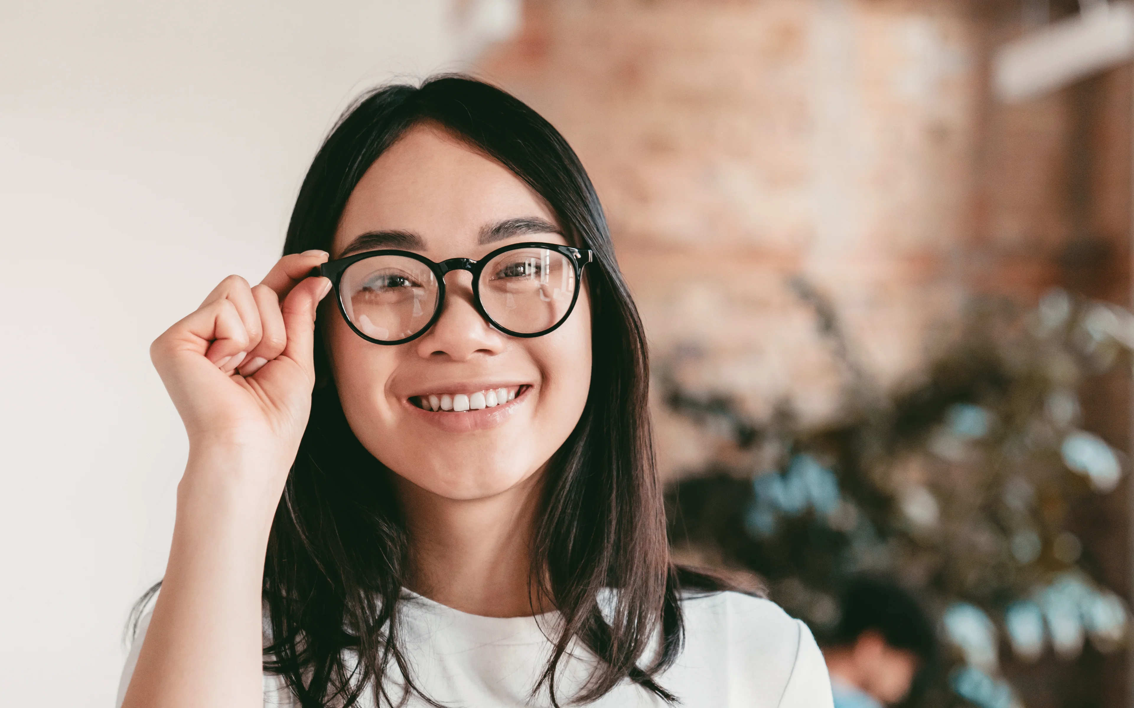 Confident asian young businesswoman smiling looking at the camera in the office.