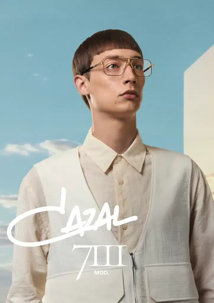 A male model wears Cazal 7111 frames.