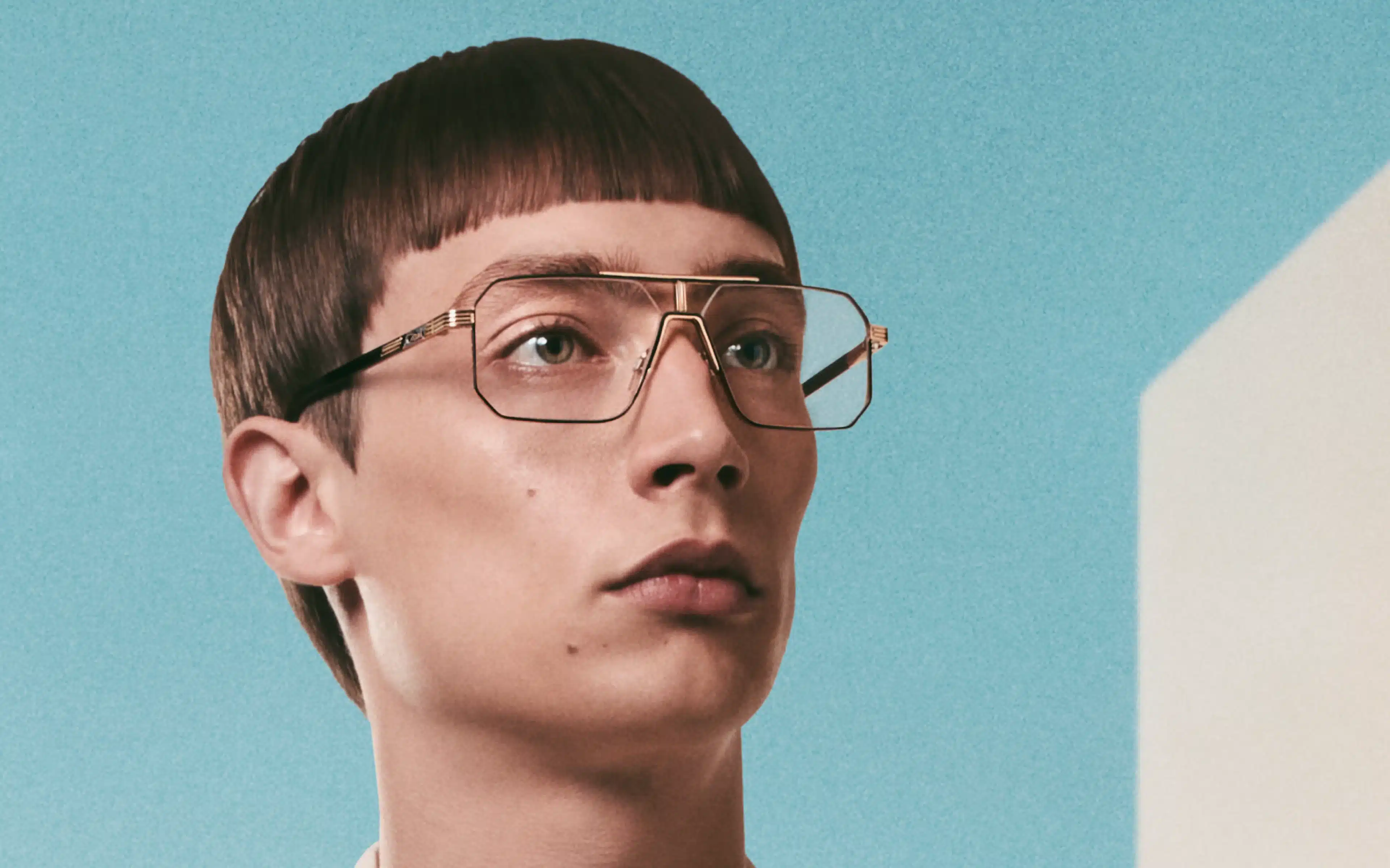 A male model wearing spectacles from the Cazal MOD 7000 catalogue.