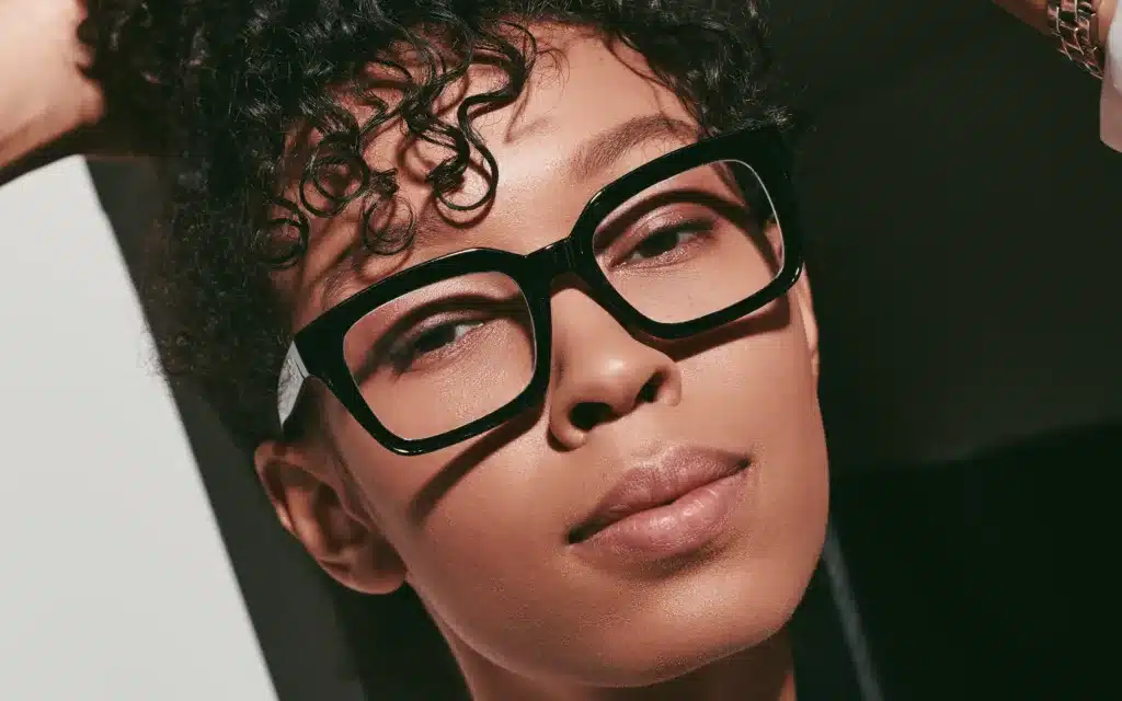 Elegance and confidence shine as a young woman poses in stylish business attire.