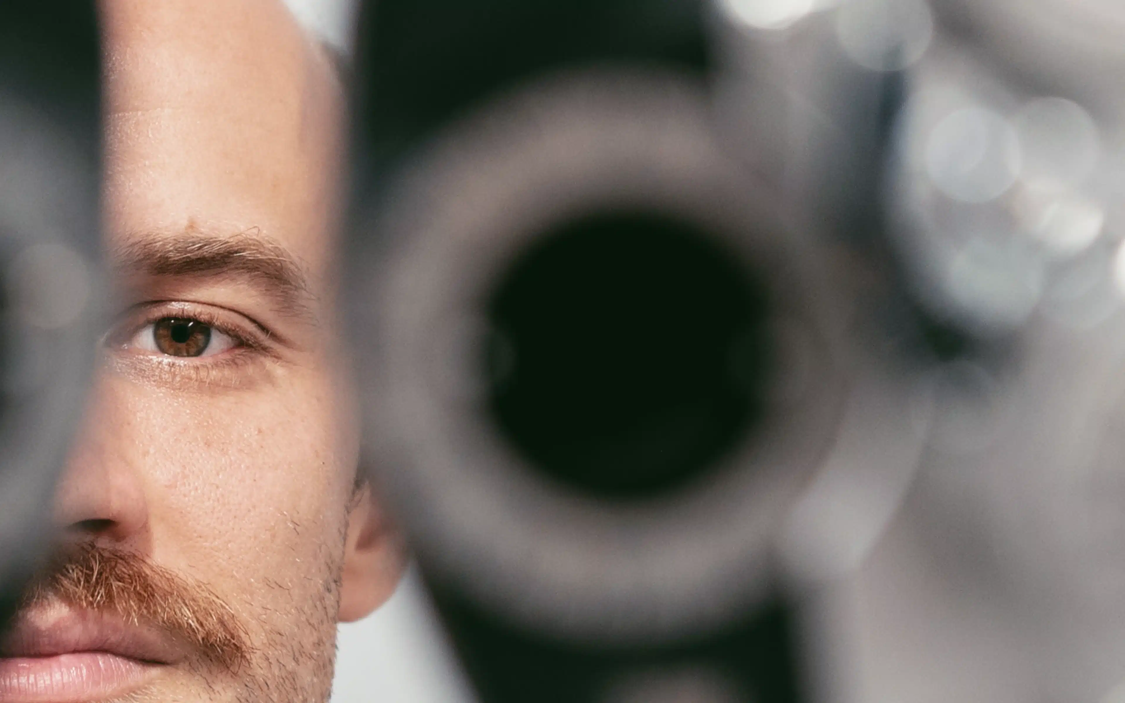 Young man getting an eye test to make glasses.
